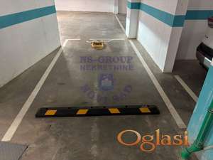 Garažno mesto u suterenu zgrade - 12m2