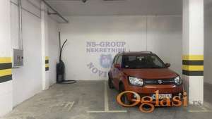 Garažno mesto u suterenu zgrade 13m2