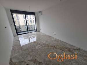 Izdaje se moderan, potpuno nov 1.5 stan sa garažnim mestom - Spens