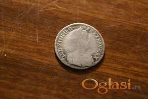 Novčić sa natpisom „Sit Nimen Domini Benedictum 1653”