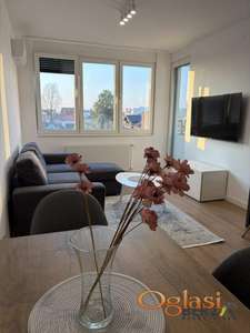 NOV NAMEŠTEN DVOSOBAN STAN NA TELEPU SA GARAŽNIM MESTOM